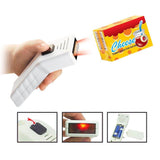 Hand holding a barcode scanner toy with light effects, designed for kids' supermarket play set.