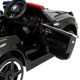 Kids electric police car interior showing steering wheel, dashboard, and open door for realistic driving fun.