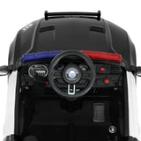Interior view of kids electric patrol police car featuring steering wheel and emergency lights.
